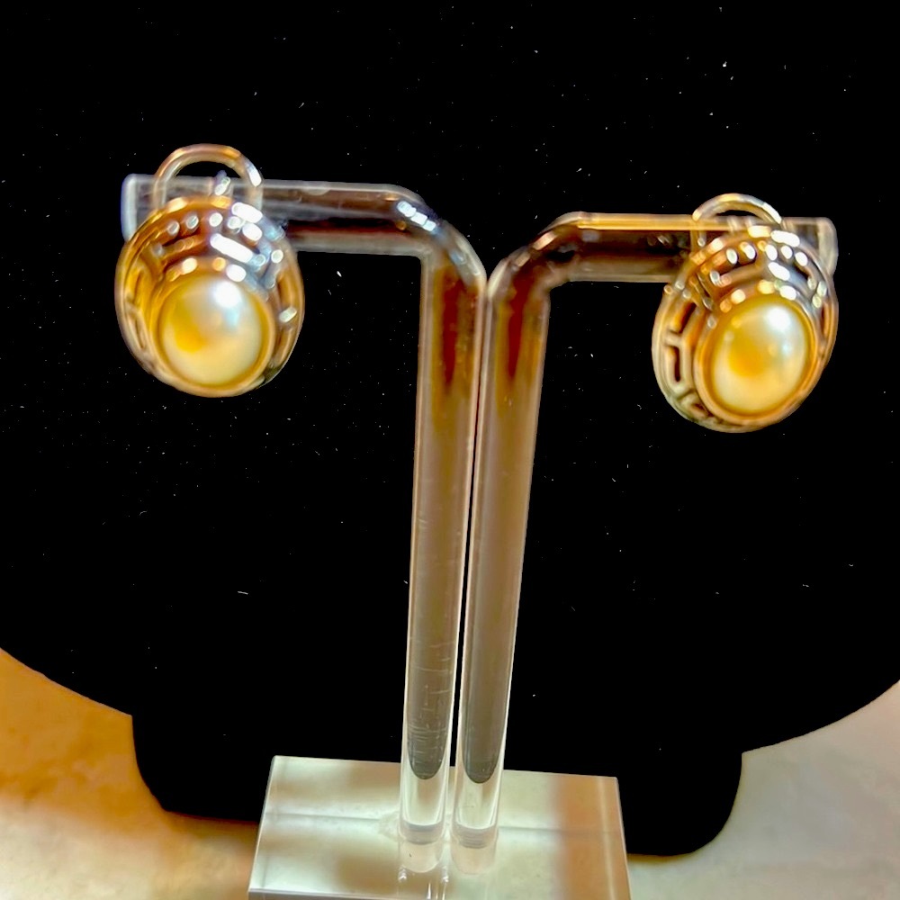 Silver and pearl French back pierced earrings.